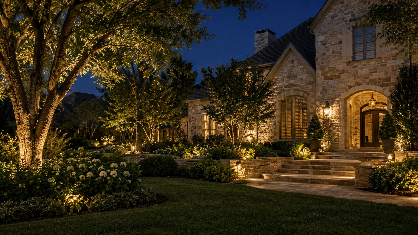 Dallas home at golden hour with a full front garden, lawn and lit entry
