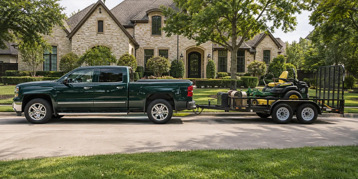Northridge Landscaping truck and trailer parked outside a Dallas home